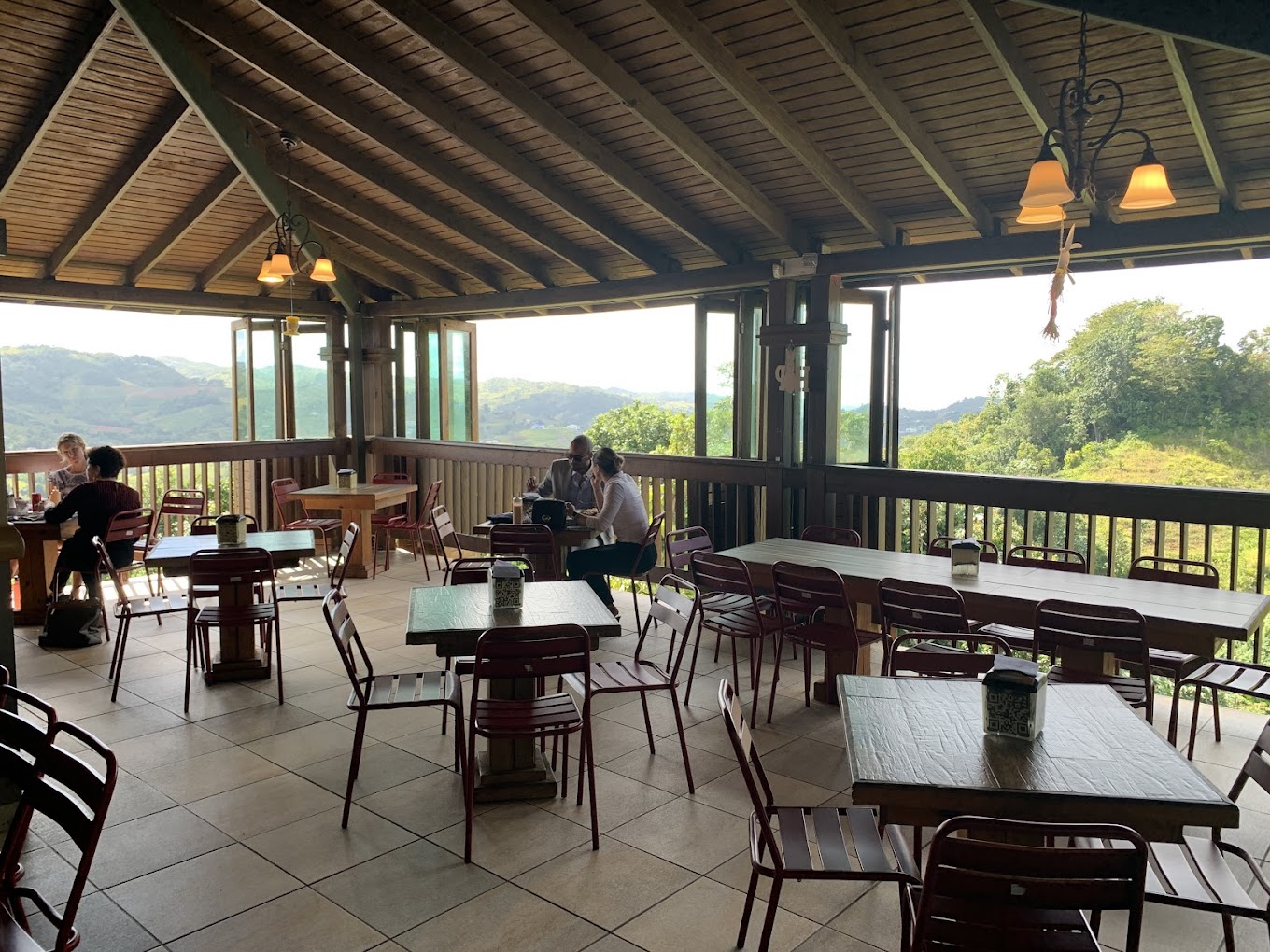 El Desahogo riverside seating under a canopy