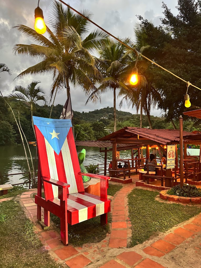 Lagolandia outdoor lawn with picnic tables and umbrellas